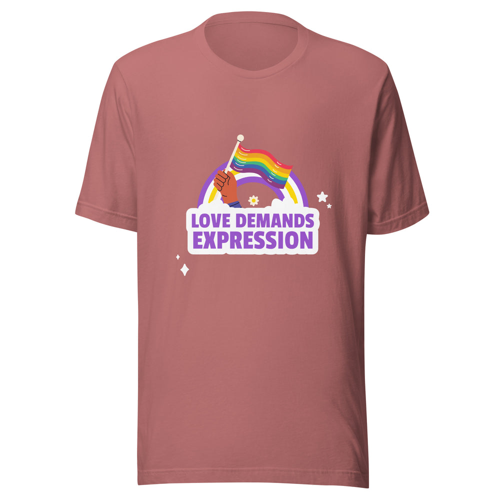Front view of a mauve T-shirt with a rainbow flag and “LOVE DEMANDS EXPRESSION” graphic