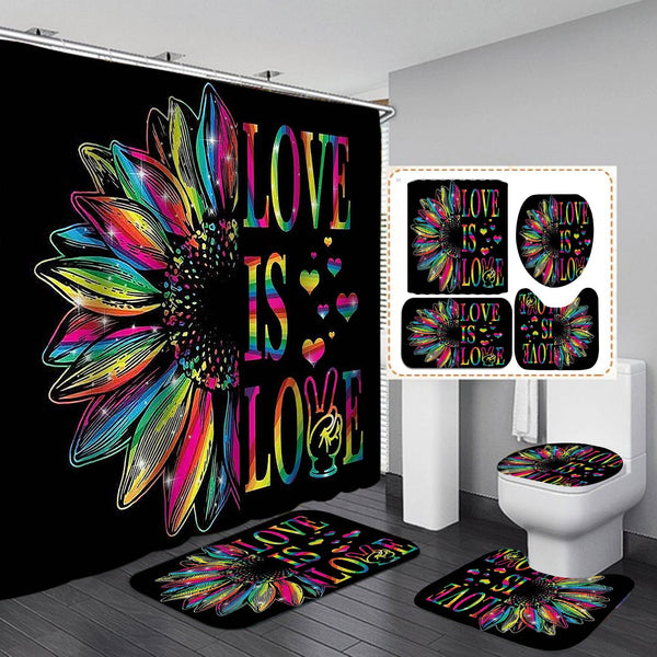 Black shower curtain and bathroom mats with a rainbow sunflower and “LOVE IS LOVE” design