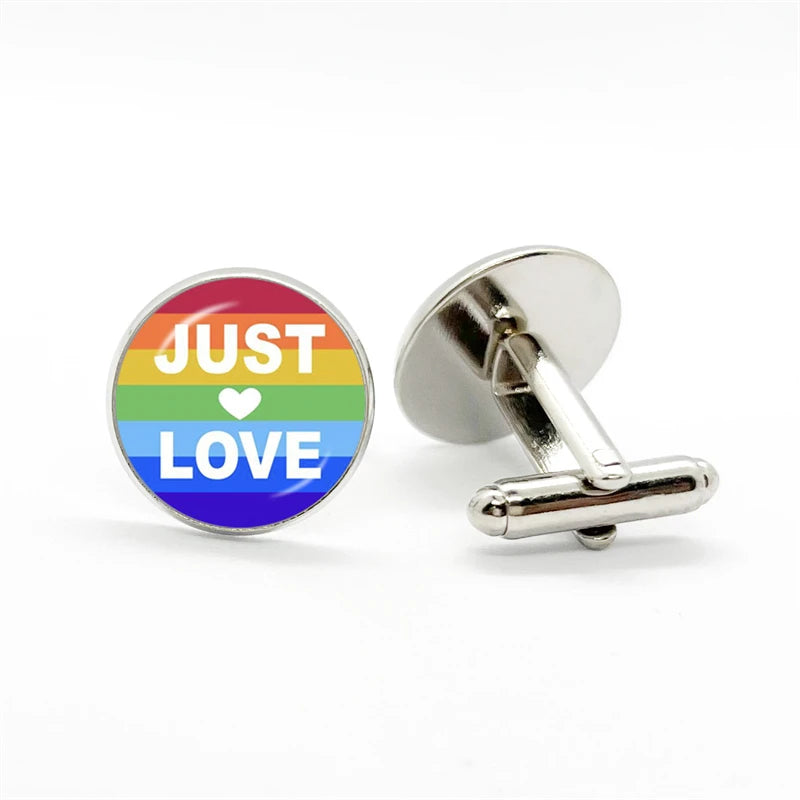 Pair of round rainbow cufflinks, one reading “JUST ♥ LOVE,” with a T-bar fastening visible
