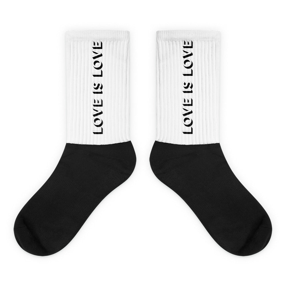 Love Is Love Socks feature a solid black foot and white ribbed calf with LOVE IS LOVE in bold letters