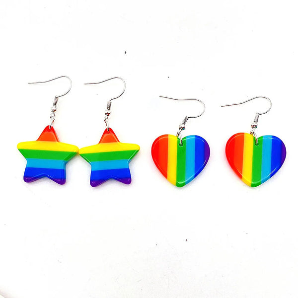 Four rainbow drop earrings: two stars and two hearts on white