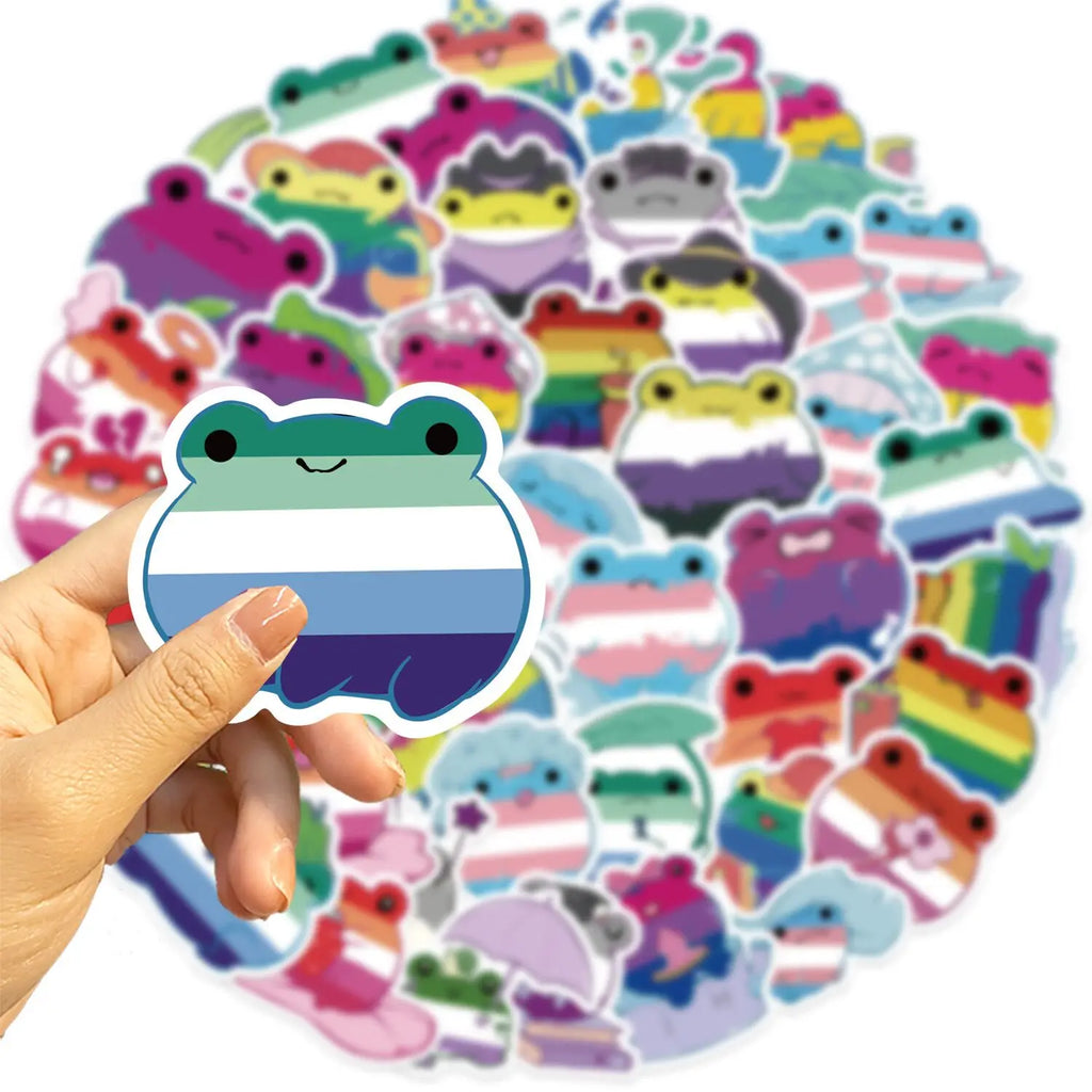 Hand holding a rainbow-striped frog sticker over a collage of colorful frog stickers