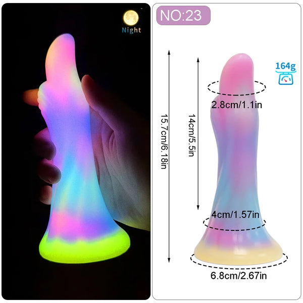 Glow-in-the-dark rainbow silicone dildo shown in hand beside a dimension diagram