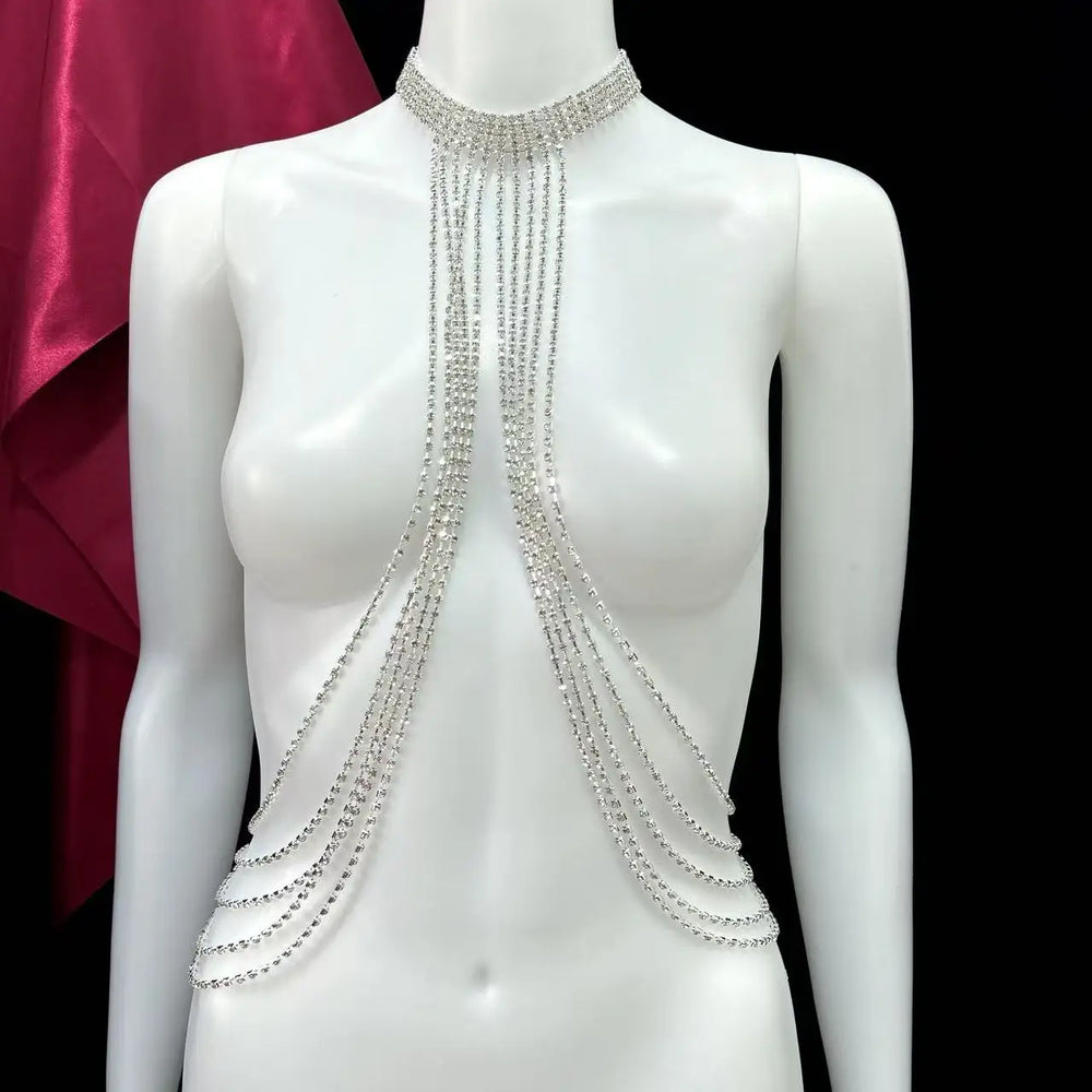 Silver rhinestone chest harness necklace displayed on a white mannequin
