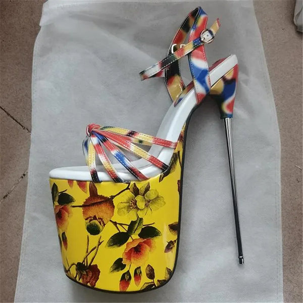 Pair of colorful floral platform stilettos with ankle straps, shown from above