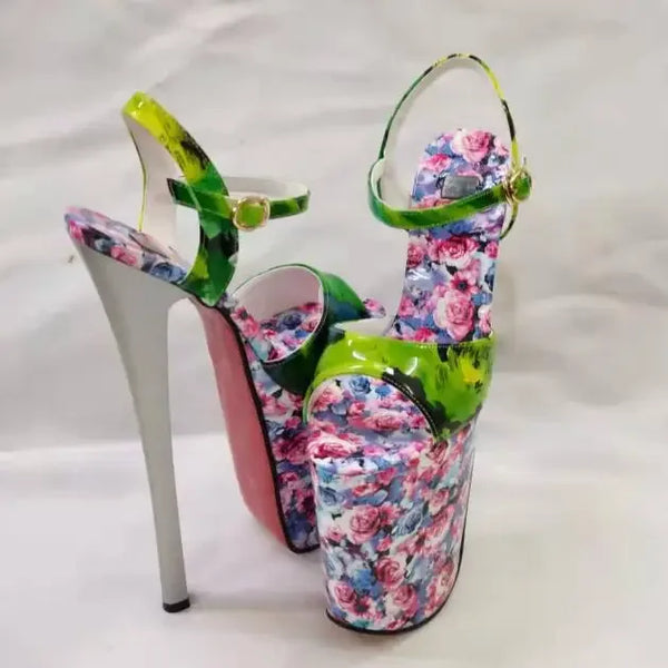 Pair of floral-print platform heels with lime-green ankle straps and towering white heels