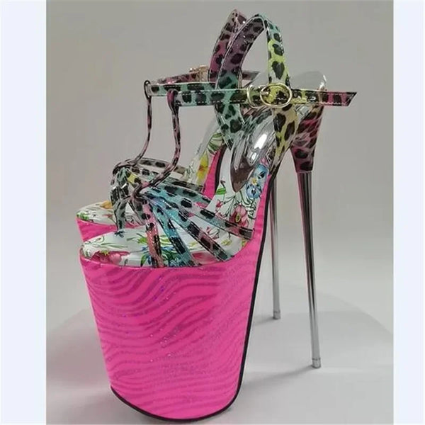 Pair of multicolor floral and leopard-print platform stiletto heels with bright pink soles