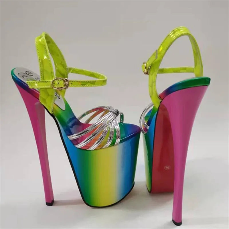 Pair of rainbow platform stilettos with neon green ankle straps and silver bands