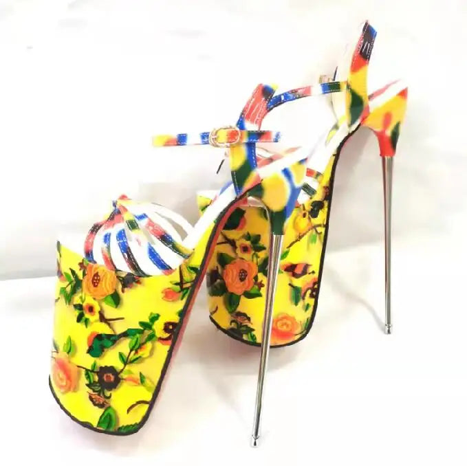 Pair of colorful floral platform stilettos with ankle straps, shown at an angle