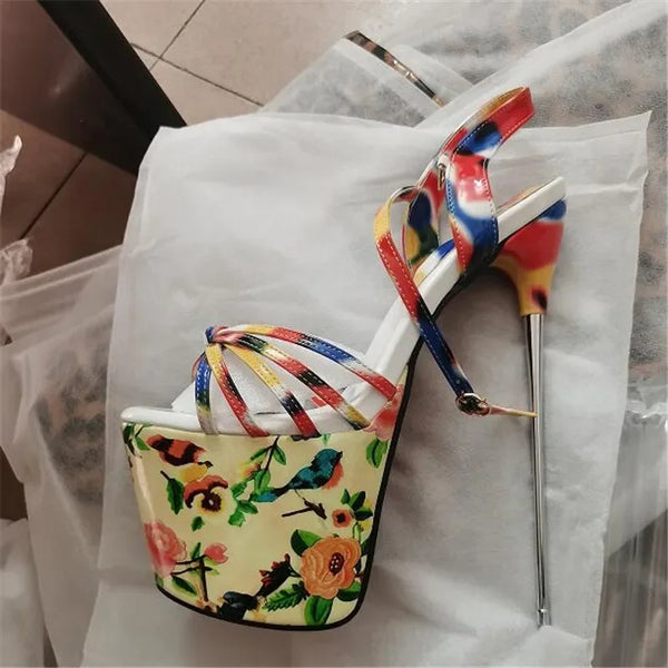 Pair of extreme platform heels with floral wedges and multicolored strappy uppers
