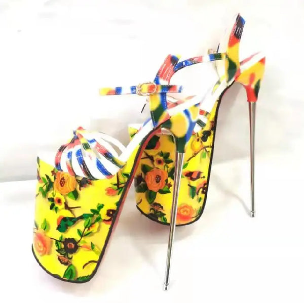 Pair of colorful floral platform stilettos with ankle straps, shown at an angle