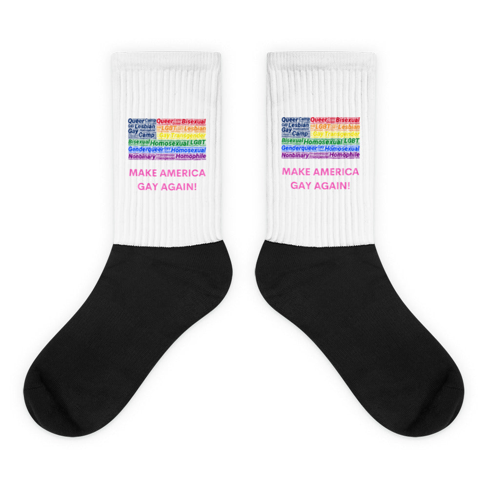 Pair of black-and-white crew socks with rainbow LGBTQ+ words and “MAKE AMERICA GAY AGAIN!”