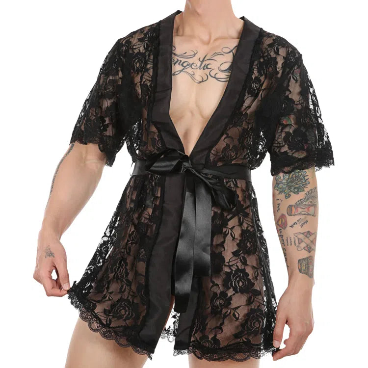 Cropped model wearing a black floral lace robe with satin trim and waist tie