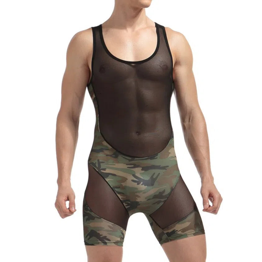 Front view of a person wearing a black mesh bodysuit with camouflage briefs and thigh panels