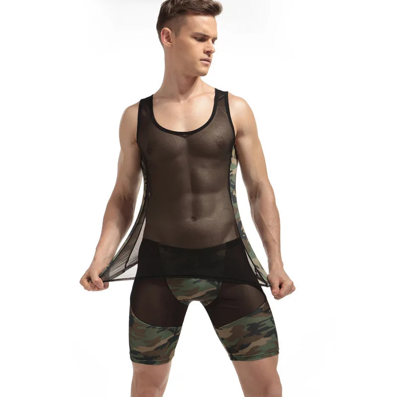 Front view of a person wearing a sheer black mesh bodysuit with camouflage panels