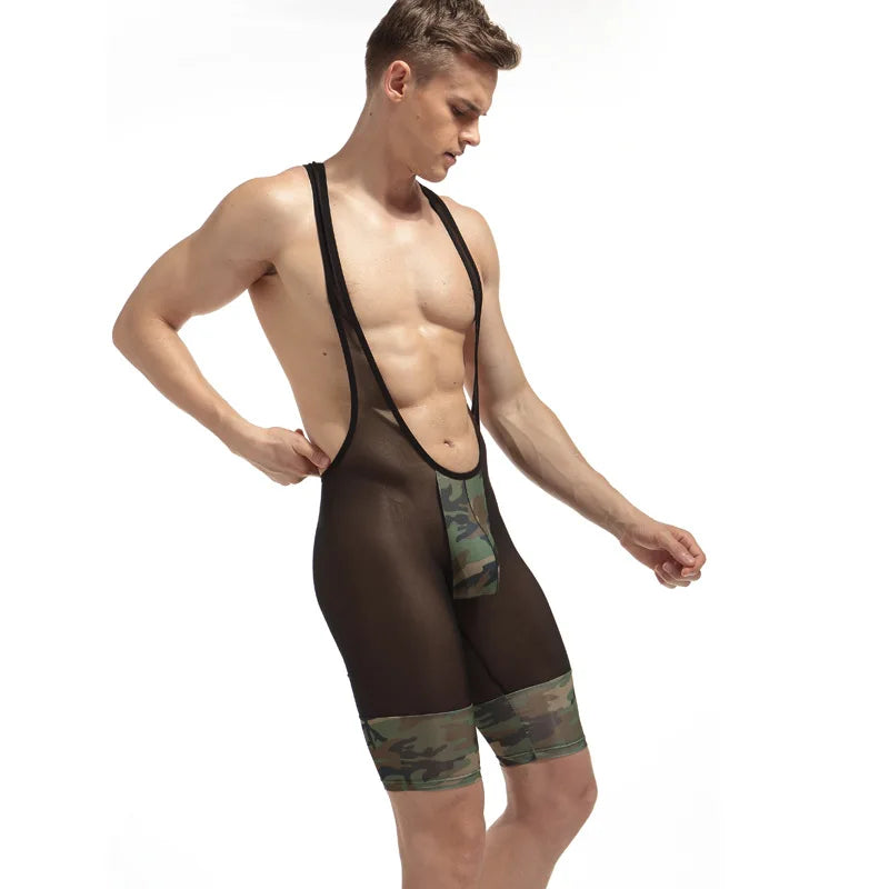 Model wearing a sheer black mesh camouflage-panel performance jumpsuit
