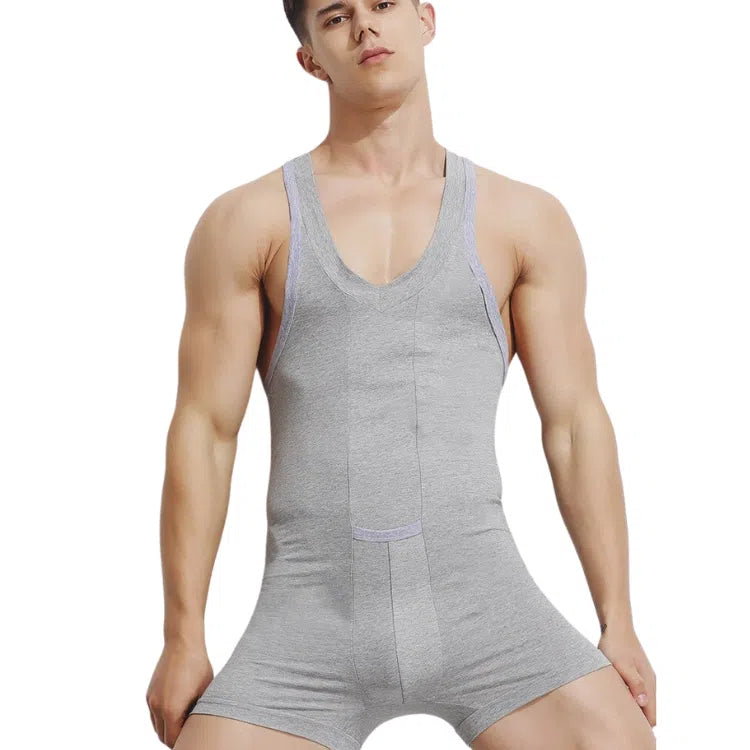 Front-view model wearing a light-gray sleeveless V-neck tank bodysuit with boxer-brief legs
