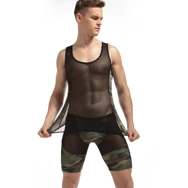 Front view of a person wearing a sheer black mesh bodysuit with camouflage panels