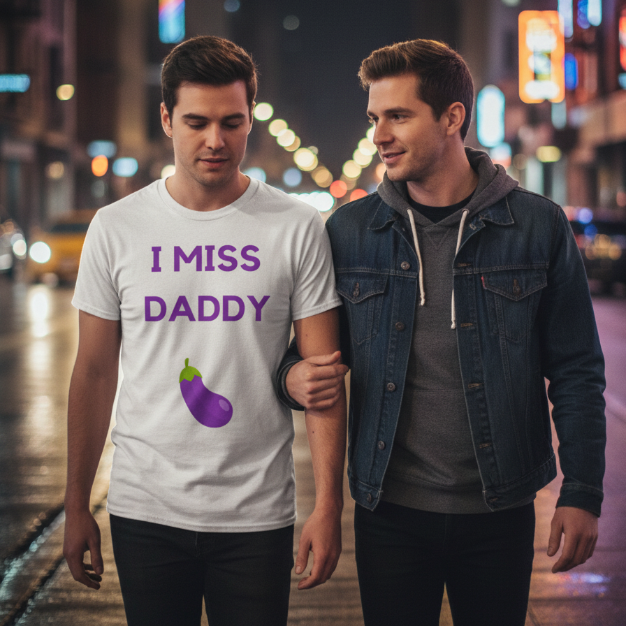 I Miss Daddy T-shirt with “I MISS DADDY” and eggplant emoji, worn by one man arm-in-arm with another in a neon-lit city at night.
