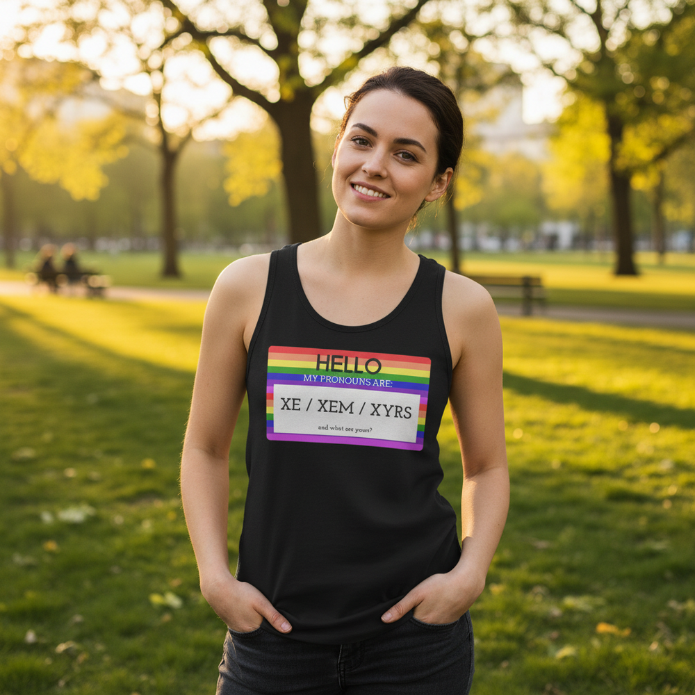 Unisex tank top with "Hello My Pronouns Are Xe / Xem / Xyrs" and rainbow pride name tag, worn by a smiling person at Pride.