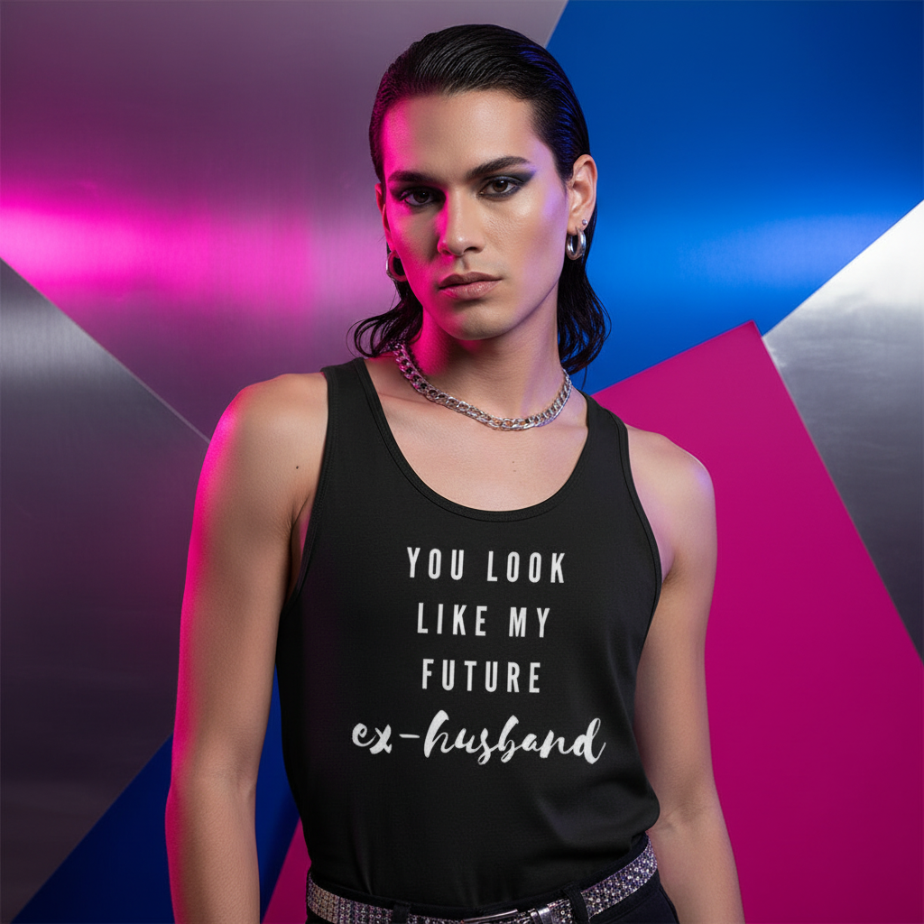 You Look Like My Future Ex-Husband" unisex tank top worn by a person with slicked-back dark hair, bold makeup, hoops, and chain; striking queer vibes in front of a vibrant metallic pink geometric backdrop.
