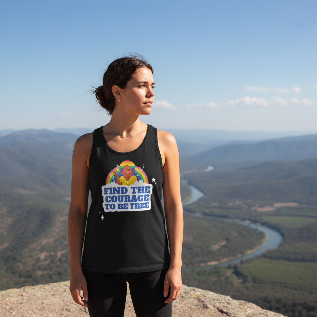 Find The Courage To Be Free tank top with a rainbow, worn by a queer woman on a mountain above a winding river, clear blue sky.
