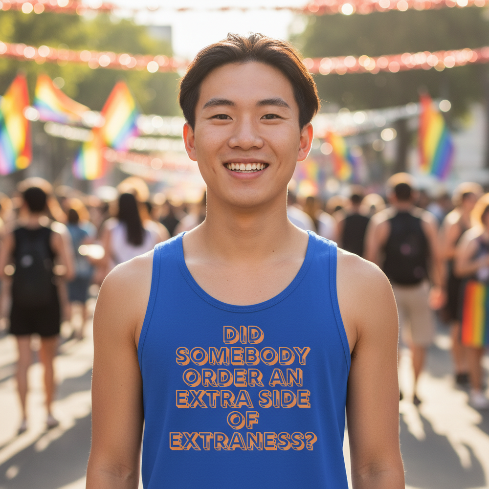 Unisex tank top with “Did somebody order an extra side of extraness?” at a sunlit pride event, rainbow flags, queer crowd.