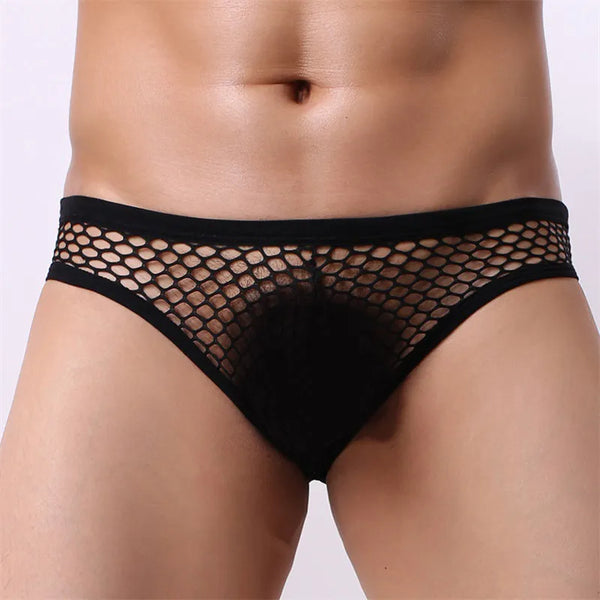 Front view of a model wearing black low-rise men's briefs with sheer fishnet mesh panels