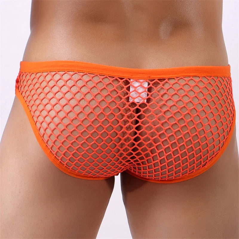 Rear close-up of a model wearing bright orange diamond-mesh low-rise briefs
