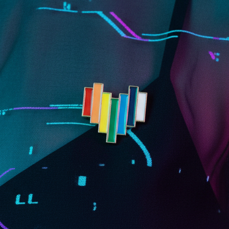 Rainbow heart enamel pin photographed against a dark, neon-lit background