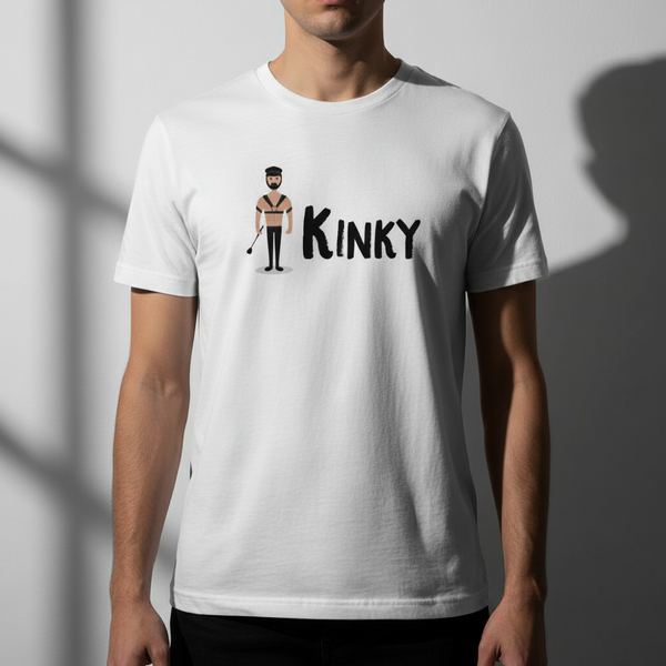 Unisex cotton pride tee reads “KINKY” with a cartoon in bondage gear; man models against white wall, face turned from camera.