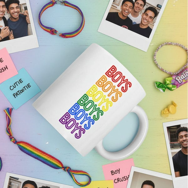 Boys Boys Boys Mug centered in a flat-lay with rainbow letters, surrounded by pride-themed photos, bracelets, and notes, embodying Queer In The World's vibrant, inclusive, and empowering celebration of LGBTQIA+ pride.