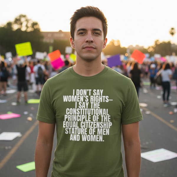 Person wearing an olive green T-shirt with a white women's rights quote at a protest