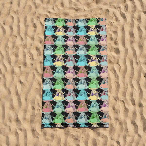 Beach towel with vibrant pastel pop-art print of a crowned drag queen in bold, colorful attire on a dark background—serving queer pride.