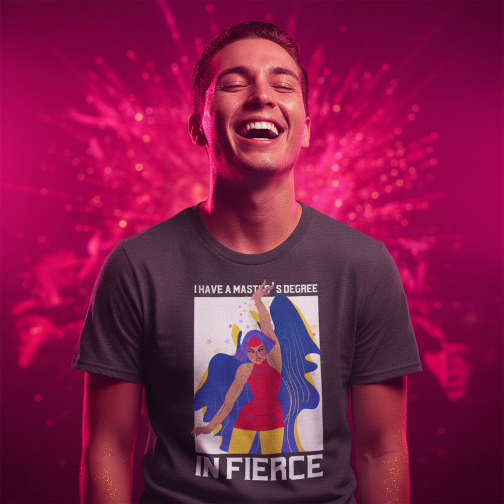 Unisex pride tee in vibrant colors, featuring a superhero woman and the slogan: “I HAVE A MASTER’S DEGREE IN FIERCE.”.