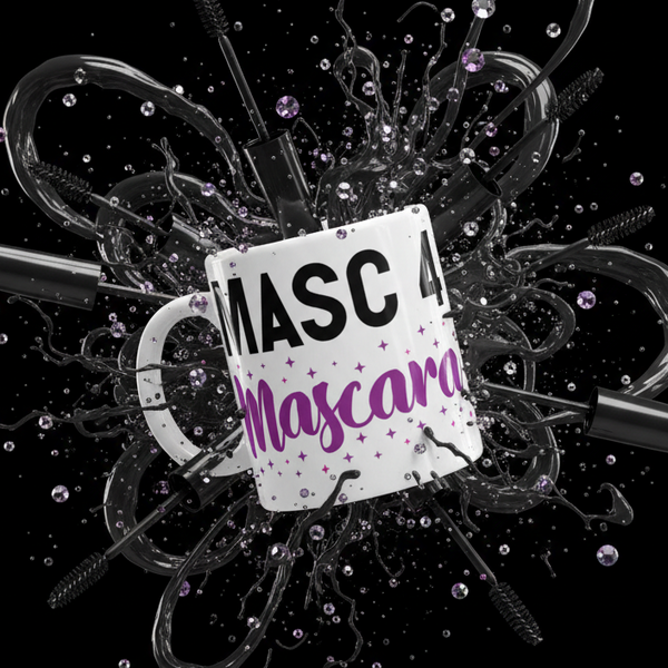White mug reading “MASC 4 Mascara,” surrounded by mascara brushes and purple glitter
