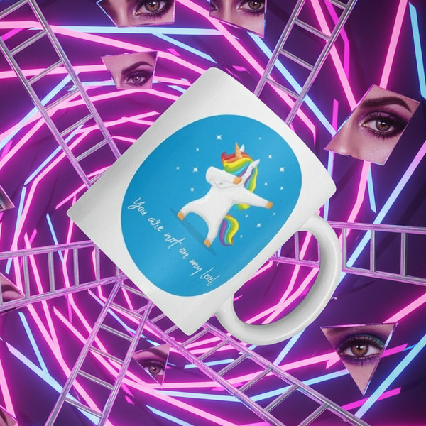 White mug with a rainbow-maned unicorn and “You are not on my level” slogan