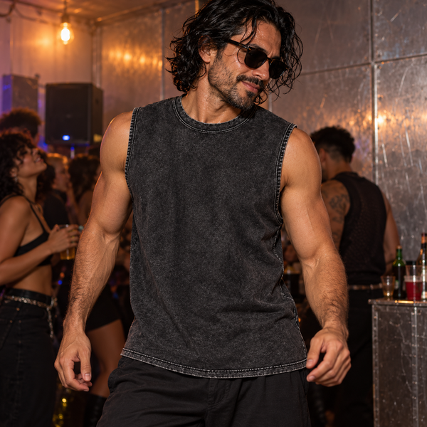 Muscle Washed Cotton Tank Top in black, worn by a muscular man with coordinated sunglasses at a club.