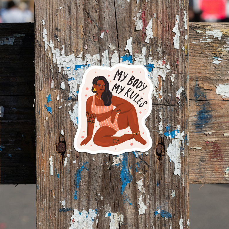 Bubble-free sticker featuring a tattooed person in an orange striped swimsuit, one knee up. “MY BODY MY RULES” in bold text