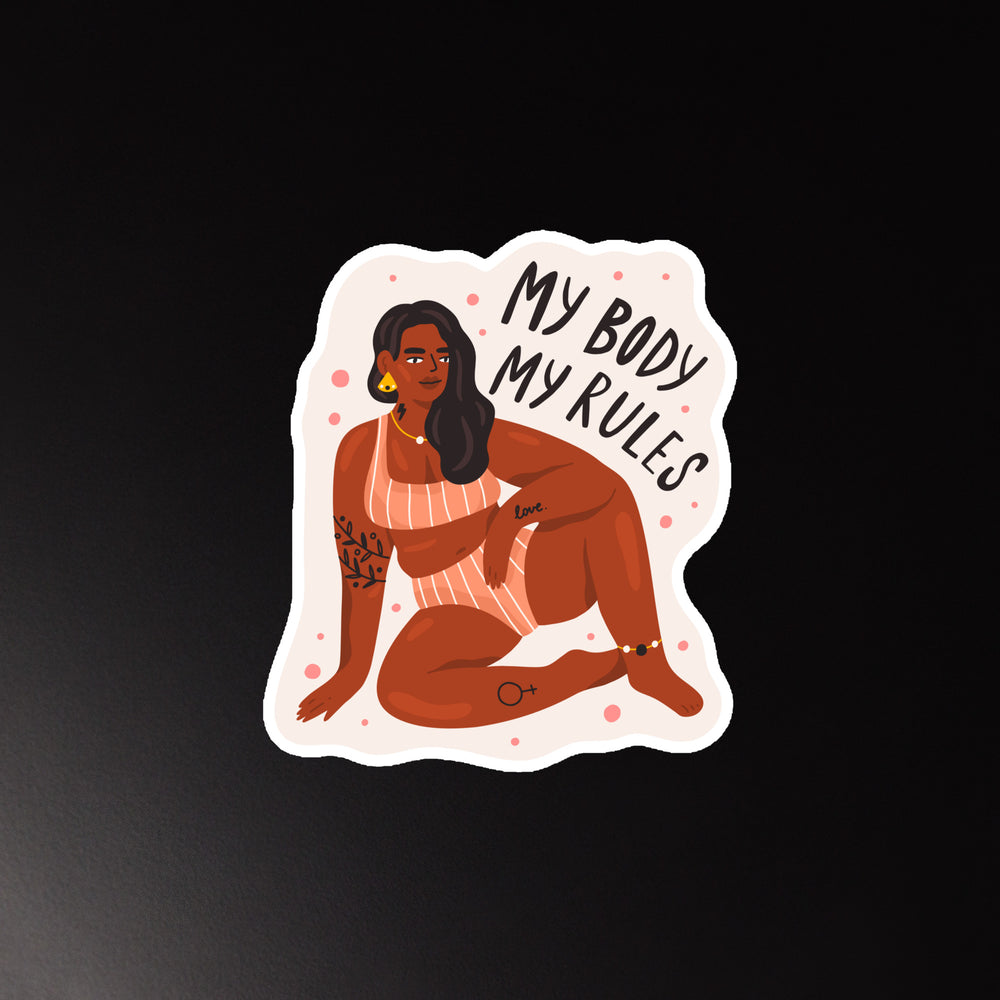 Die-cut magnet showing a seated woman and the words “My Body My Rules”