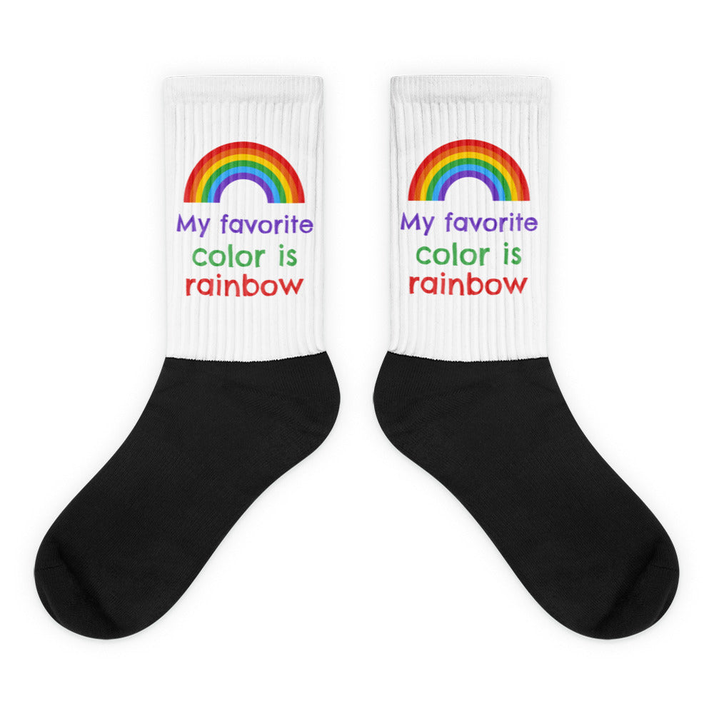 My Favorite Colour Is Rainbow Socks feature a six-color rainbow and phrase on white ribbed cuffs with black feet