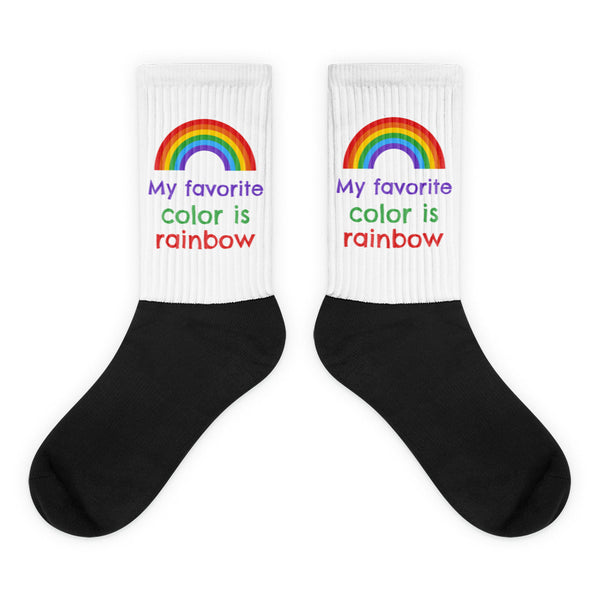 My Favorite Colour Is Rainbow Socks feature a six-color rainbow and phrase on white ribbed cuffs with black feet