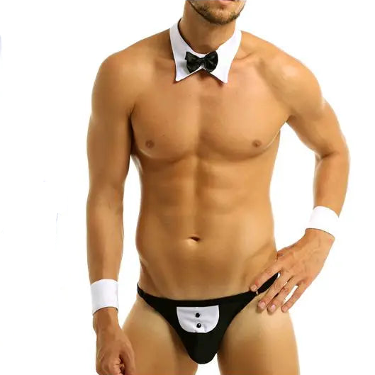 Cropped model wearing a black tuxedo-style thong with bow tie and cuffs
