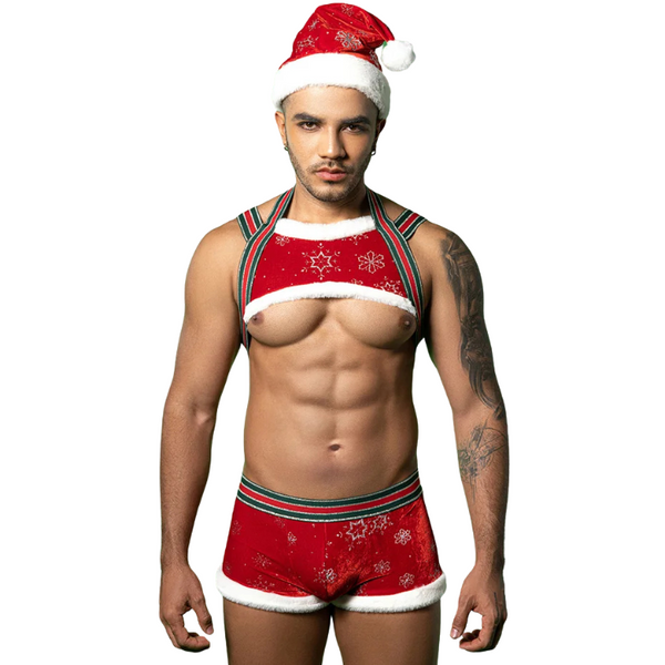 Front-facing model wearing a red Santa hat, chest harness top, and matching shorts