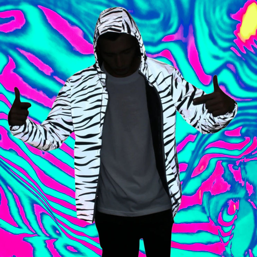 Front-facing person wears a white-and-black zebra-print hooded jacket over a dark shirt