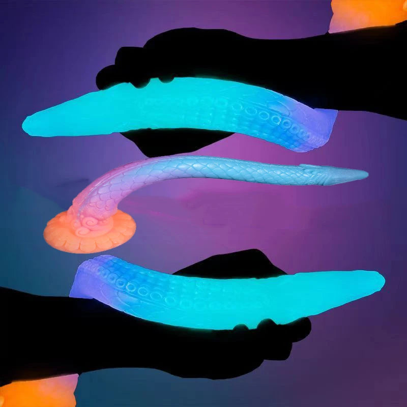 Three long tentacle-shaped sex toys glowing blue and pink, with textured suckers and flared bases