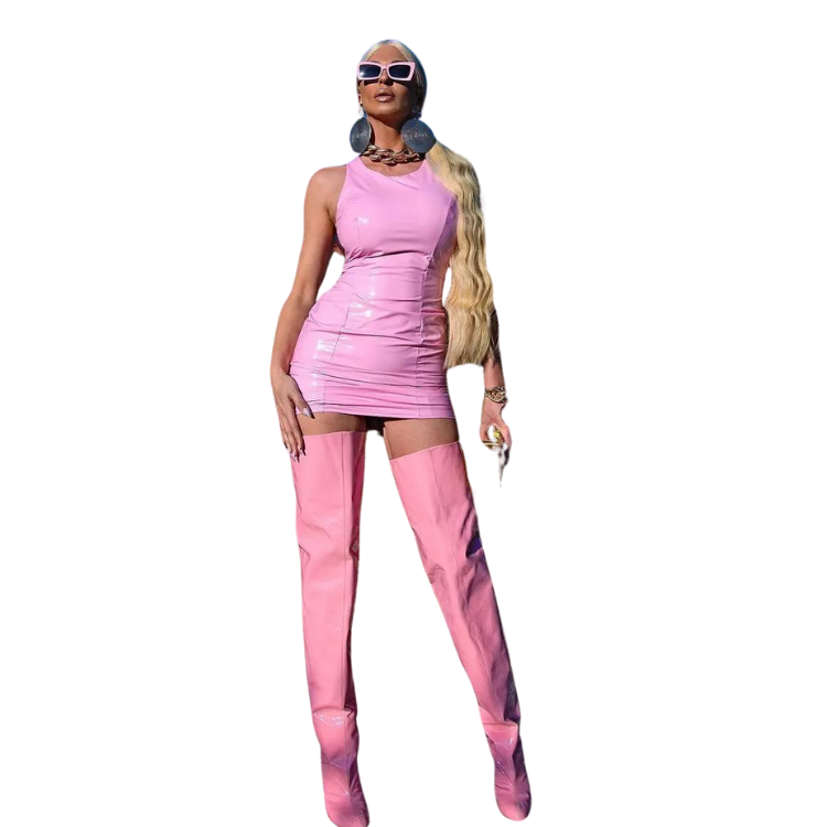 Full-length model wearing glossy pink thigh-high stiletto boots with pointed toes