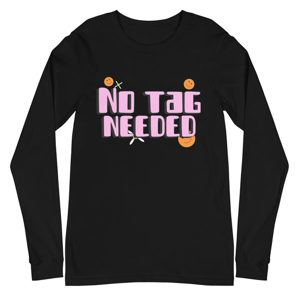 Black unisex long sleeve tee with bold pink and white “NO TAG NEEDED,” four orange smiley faces, and two safety pins.