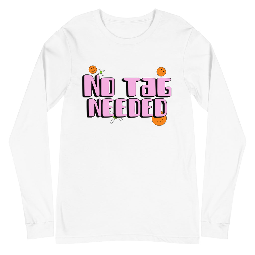 Unisex long sleeve tee with bold pink and black “NO TAG NEEDED” bubble letters, orange smiley faces, and a tiny green flower