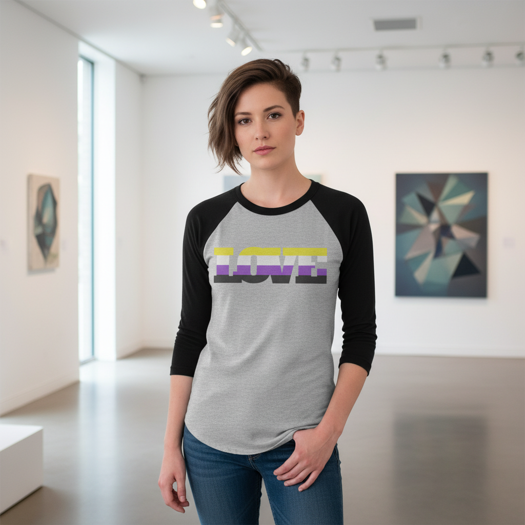 Non-Binary LOVE 3/4 sleeve raglan shirt with "LOVE" in yellow, white, and purple stripes, worn by a person in an art gallery